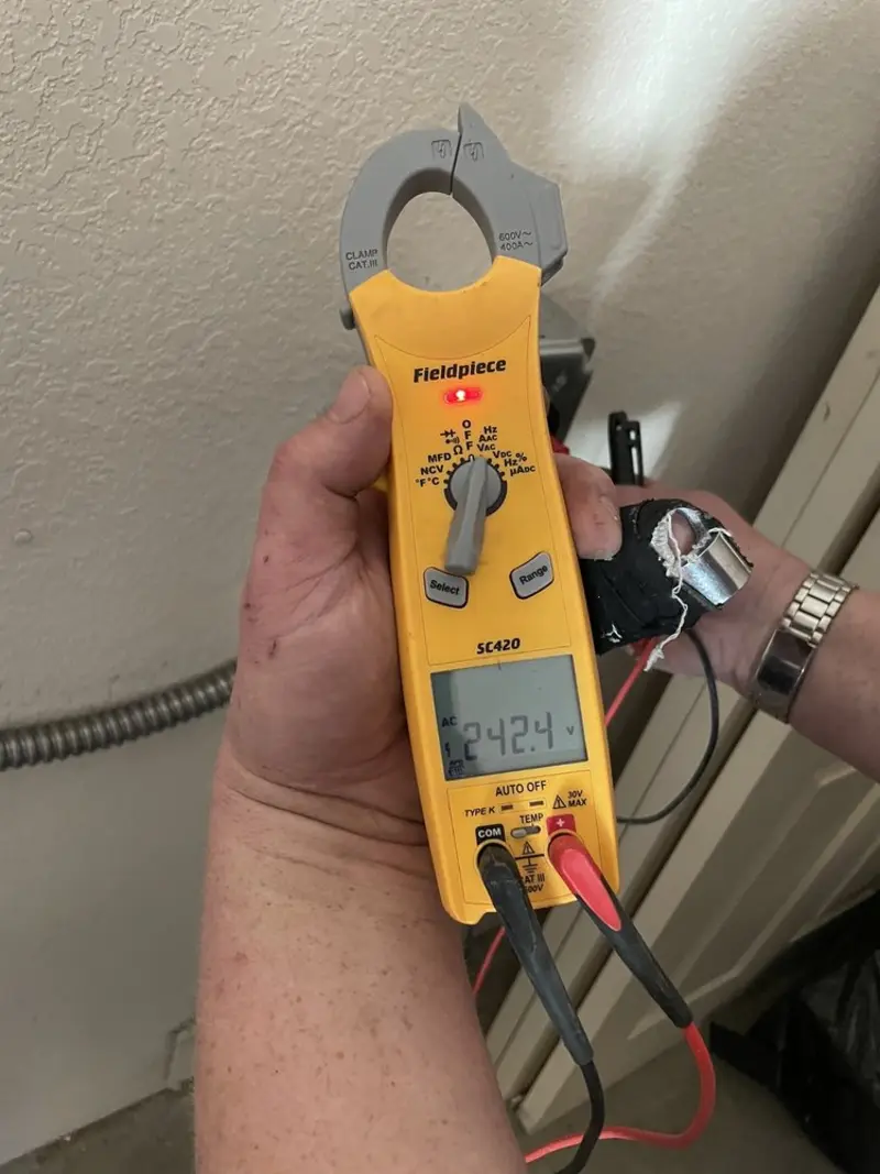 Voltage testing with clamp meter during Outlet Installation in Tolleson